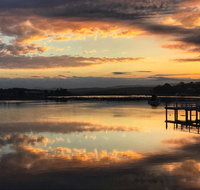 Reflections on Merimbula Lake - Northern Rivers Accommodation
