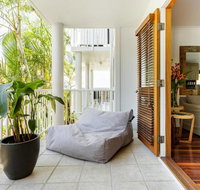 Stylish Tropical Oasis Apartment with Hot Tub and Four Pools
