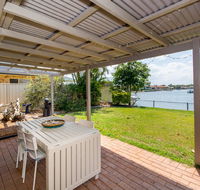 Lowset home on the canal - Dolphin Dr Bongaree - Northern Rivers Accommodation