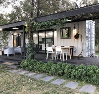 Absolute riverfront shipping container cabin - Northern Rivers Accommodation